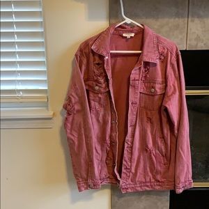 Distressed pink denim jacket
